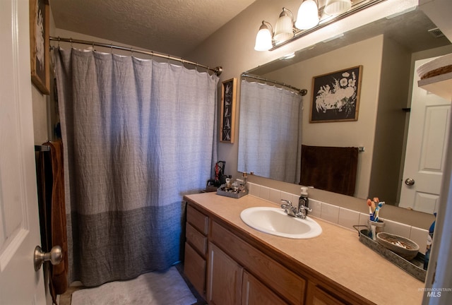 8340 E Expedition, Nampa, ID 83687 - full bathroom featuring vanity, a textured ceiling, and curtained shower