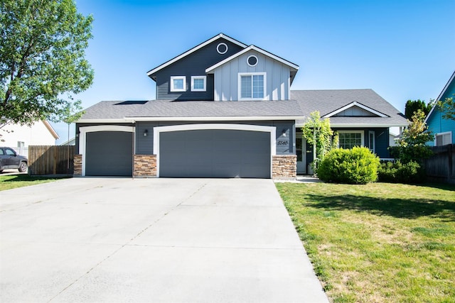 8340 E Expedition, Nampa, ID 83687 - view of front facade featuring board and batten siding, concrete driveway, a garage, stone siding, and an attached garage