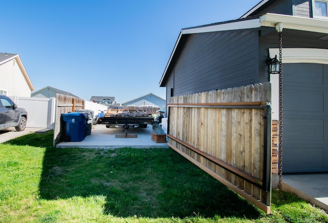 8340 E Expedition, Nampa, ID 83687 - view of yard with a garage and a patio area