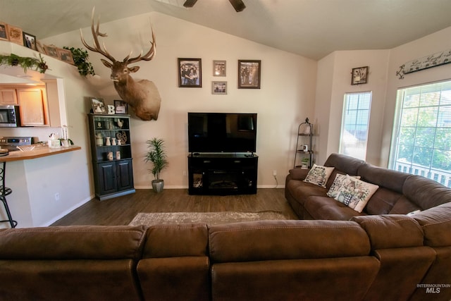 8340 E Expedition, Nampa, ID 83687 - living area featuring dark wood-style flooring, vaulted ceiling, baseboards, and a ceiling fan