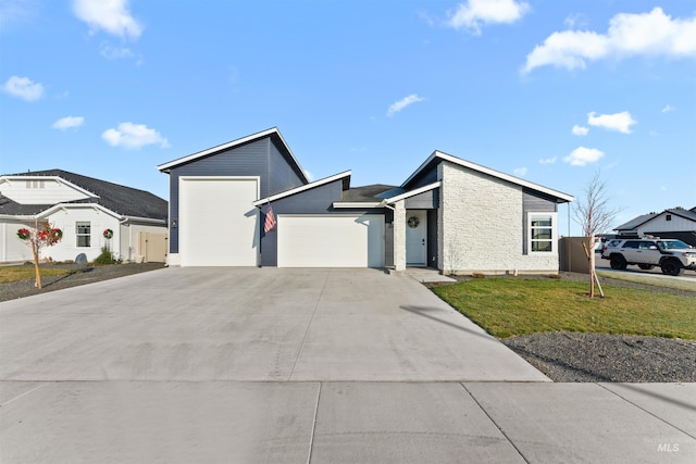 view of front facade with a front yard and a garage