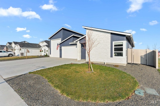 view of front facade featuring a garage and a front lawn