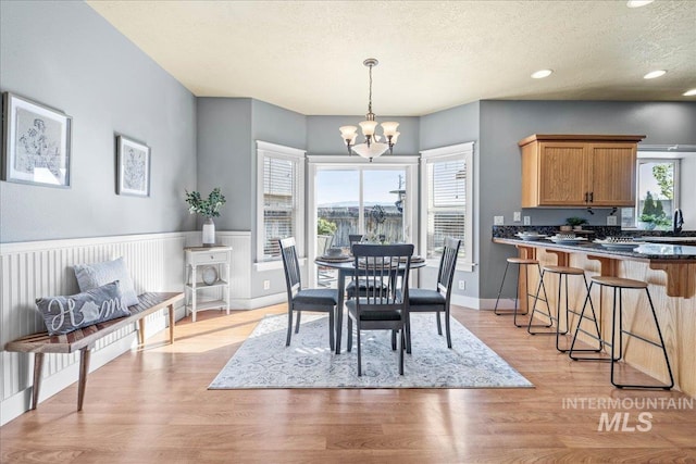 568 S Wooddale Pl, Eagle, ID 83616 - dining space featuring recessed lighting, light wood-style floors, a textured ceiling, and a chandelier