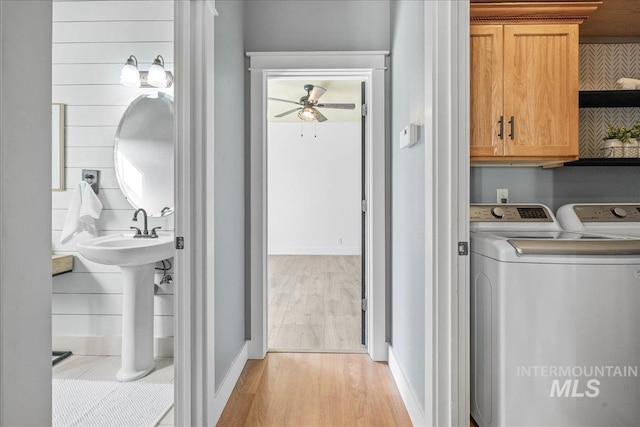 568 S Wooddale Pl, Eagle, ID 83616 - laundry room with light wood-style floors, ceiling fan, cabinet space, washing machine and dryer, and baseboards