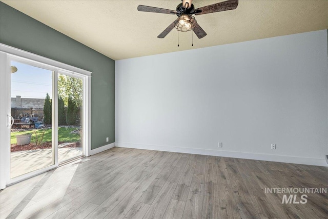 568 S Wooddale Pl, Eagle, ID 83616 - spare room featuring light wood-type flooring, a ceiling fan, and baseboards