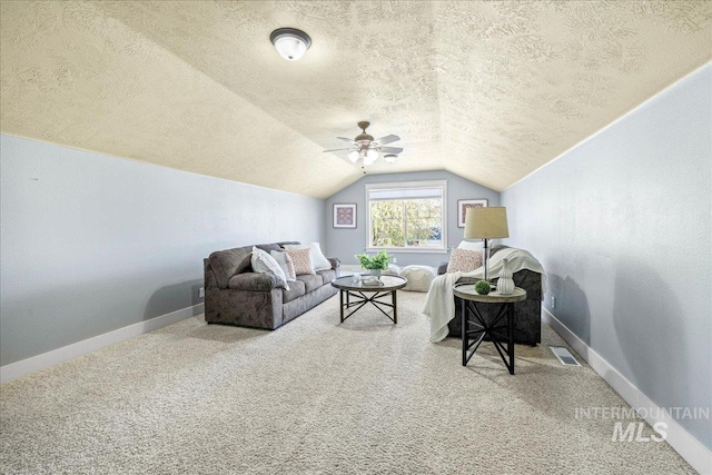 568 S Wooddale Pl, Eagle, ID 83616 - carpeted living area featuring a textured ceiling, baseboards, visible vents, lofted ceiling, and a ceiling fan