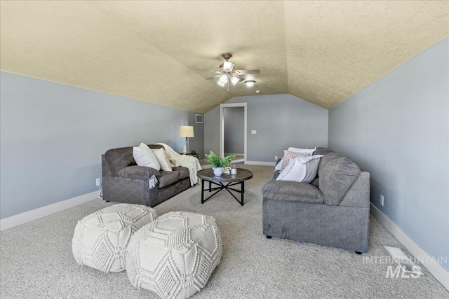 568 S Wooddale Pl, Eagle, ID 83616 - living room with lofted ceiling, a ceiling fan, carpet floors, baseboards, and a textured ceiling