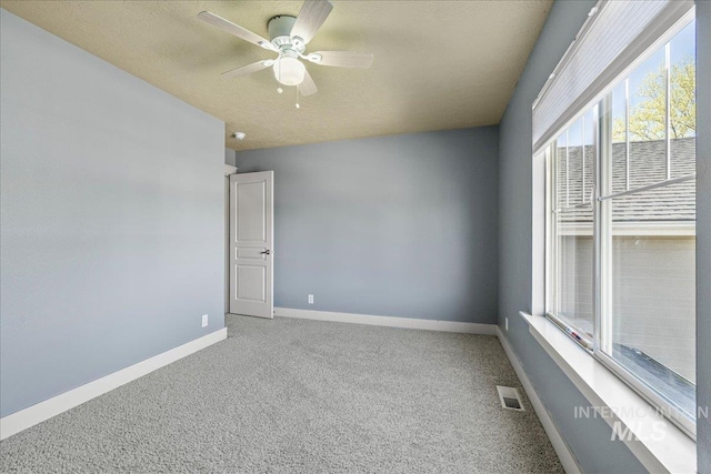 568 S Wooddale Pl, Eagle, ID 83616 - carpeted spare room with visible vents, a ceiling fan, and baseboards