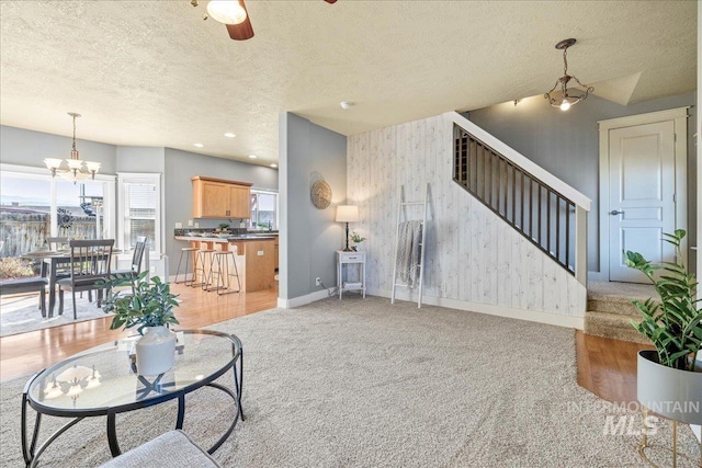 568 S Wooddale Pl, Eagle, ID 83616 - living area with stairway, baseboards, a textured ceiling, and light carpet