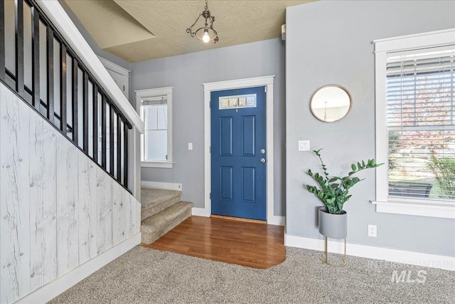 568 S Wooddale Pl, Eagle, ID 83616 - carpeted foyer entrance featuring baseboards, a wealth of natural light, and stairs