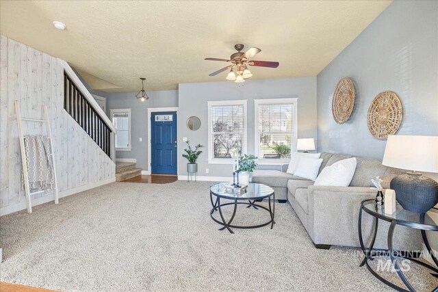 568 S Wooddale Pl, Eagle, ID 83616 - carpeted living area featuring a ceiling fan, baseboards, and stairs