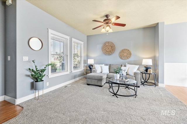568 S Wooddale Pl, Eagle, ID 83616 - living room featuring wood finished floors, visible vents, a ceiling fan, and baseboards