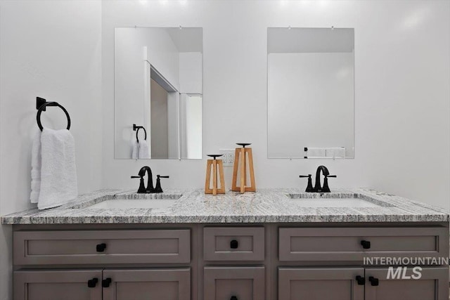 bathroom with double vanity and a sink