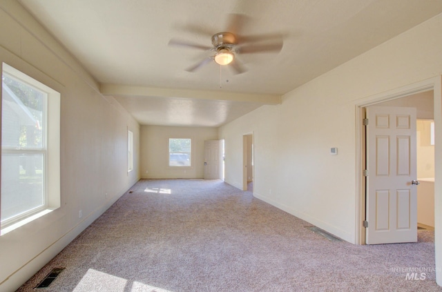 empty room featuring visible vents, baseboards, carpet, and ceiling fan