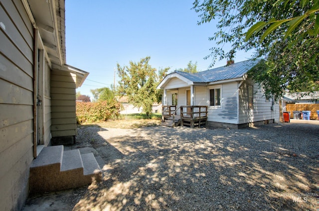 exterior space with covered porch and metal roof