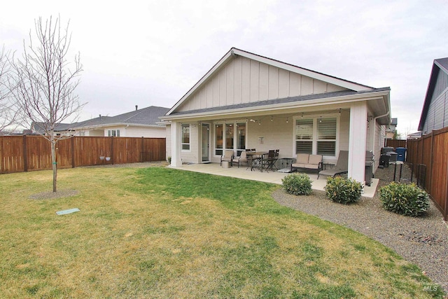 520 S Prospector Ln, Eagle, ID 83616 - back of property with a patio area and board and batten siding