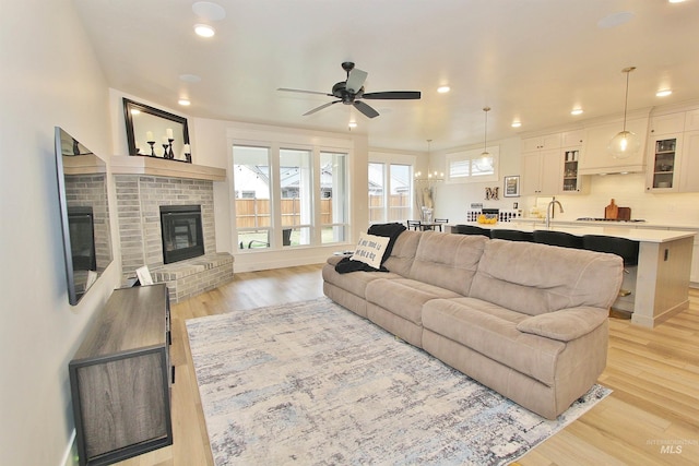 520 S Prospector Ln, Eagle, ID 83616 - living room with a ceiling fan, light wood finished floors, recessed lighting, and a fireplace