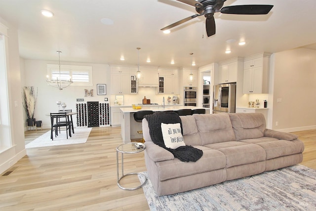 520 S Prospector Ln, Eagle, ID 83616 - living area featuring a chandelier, light wood-style floors, baseboards, recessed lighting, and ceiling fan