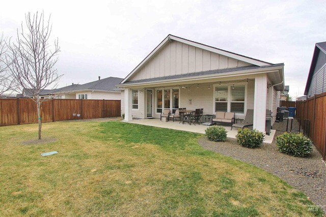 520 S Prospector Ln, Eagle, ID 83616 - rear view of property with board and batten siding and a patio area