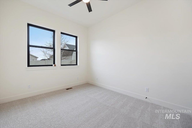 carpeted empty room with ceiling fan