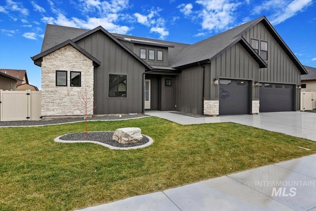 modern farmhouse style home with a garage and a front lawn