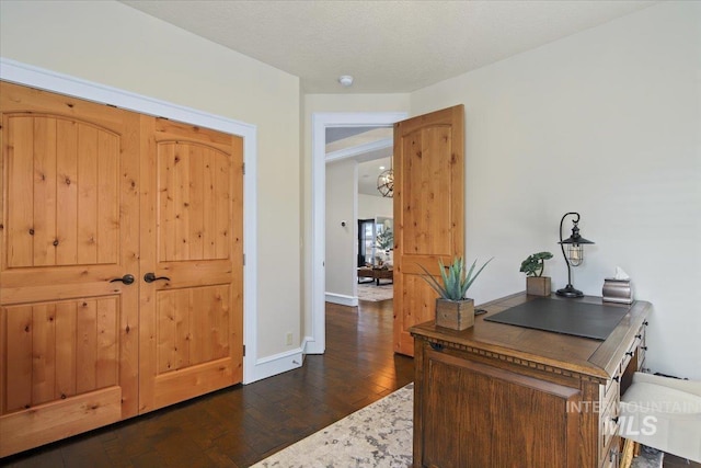 office area featuring dark hardwood / wood-style floors and a textured ceiling