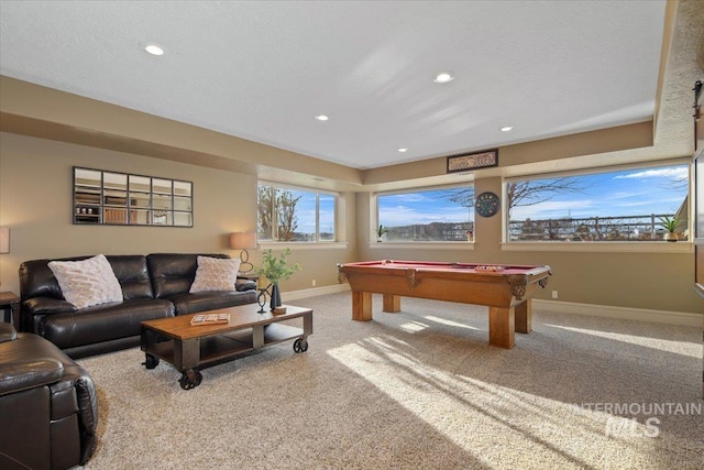 recreation room featuring pool table, a textured ceiling, and carpet