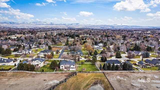 birds eye view of property with a mountain view