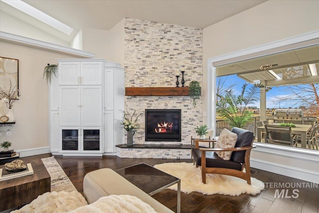 living room featuring a fireplace and dark hardwood / wood-style flooring