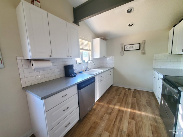2315 NW 14th St, Meridian, ID 83646 - kitchen featuring a sink, appliances with stainless steel finishes, backsplash, white cabinetry, and wood finished floors