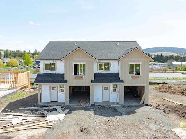 2827 Cyprus, Moscow, ID 83843 - view of front of home with a shingled roof, board and batten siding, and an attached garage
