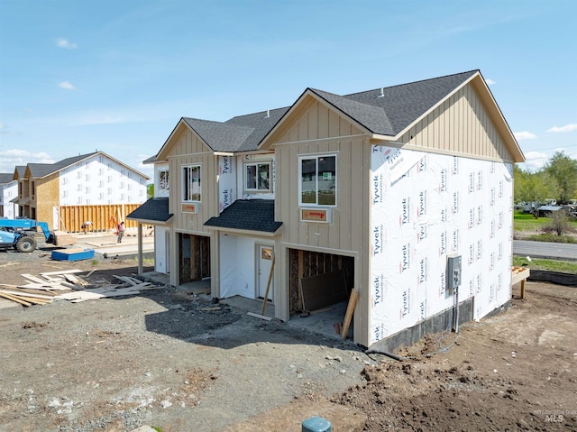 2827 Cyprus, Moscow, ID 83843 - unfinished property featuring roof with shingles, board and batten siding, and an attached garage