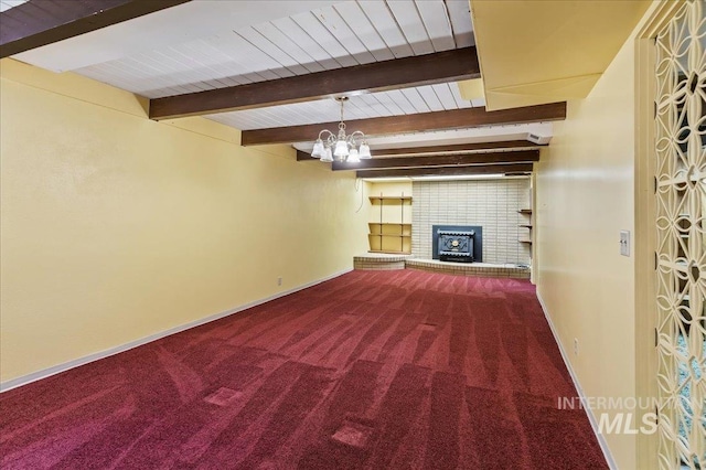 unfurnished living room with beam ceiling, baseboards, and carpet floors