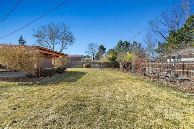 view of yard with a fenced backyard