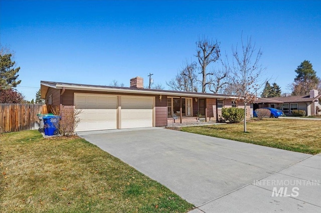 single story home with fence, concrete driveway, an attached garage, a front yard, and a chimney