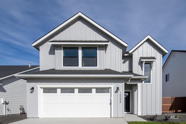 modern inspired farmhouse with a garage, a shingled roof, board and batten siding, and concrete driveway