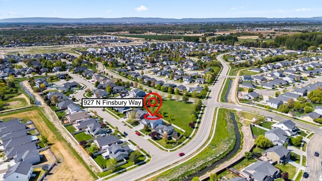 aerial view featuring a mountain view and a residential view
