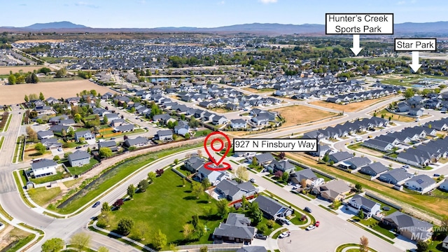 birds eye view of property with a residential view and a mountain view