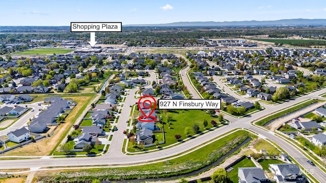 birds eye view of property featuring a mountain view and a residential view