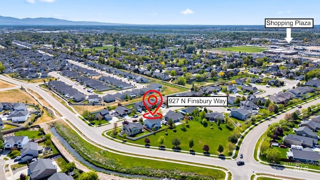 drone / aerial view with a residential view and a mountain view