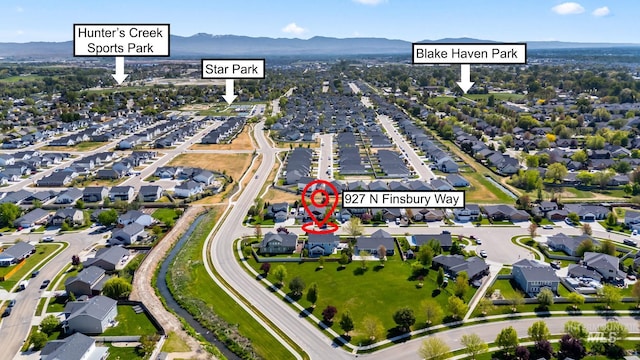 bird's eye view with a residential view and a mountain view