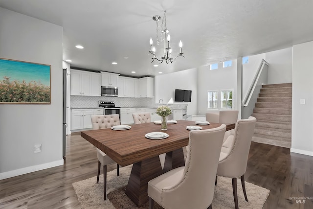 dining area with dark wood finished floors, a chandelier, stairs, recessed lighting, and baseboards