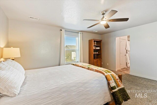 carpeted bedroom with baseboards and a ceiling fan