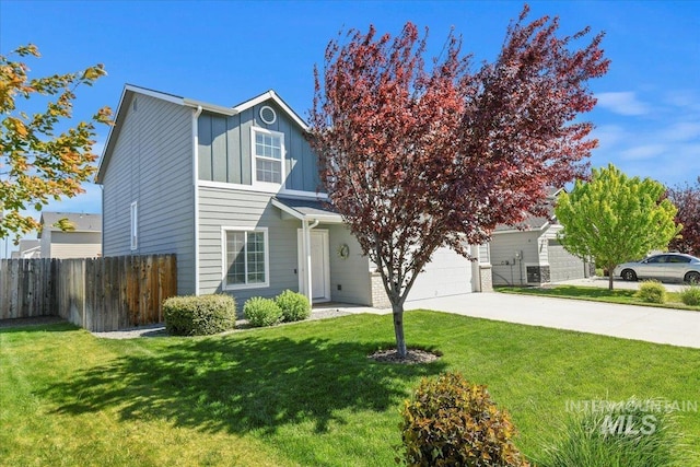 traditional-style house with concrete driveway and board and batten siding
