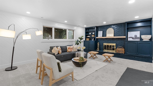 carpeted living area featuring a brick fireplace, baseboards, built in features, and recessed lighting