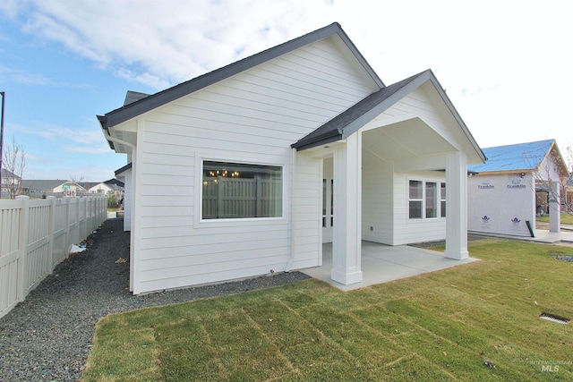 4658 S Hennessy Ave, Meridian, ID 83642 - rear view of property with a lawn, a patio area, and fence
