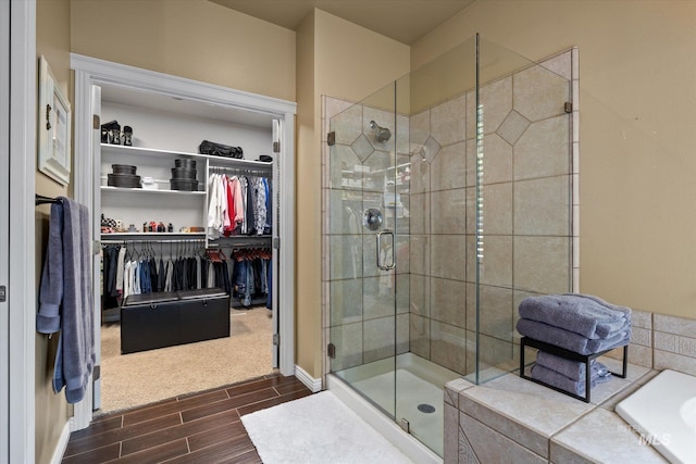 bathroom featuring a shower with shower door