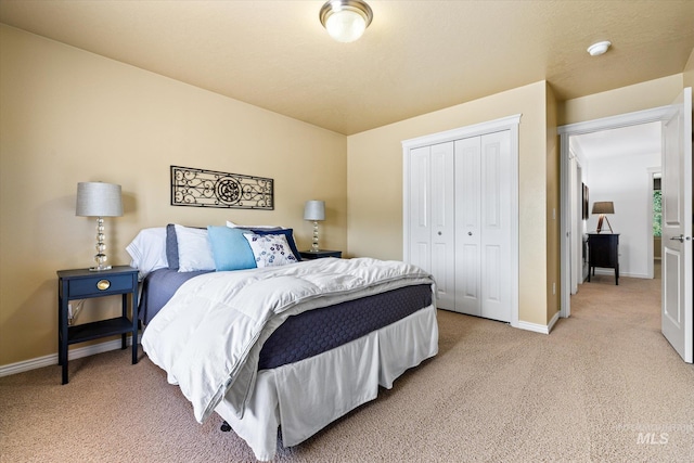 bedroom with light colored carpet and a closet