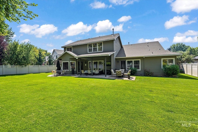 rear view of house featuring outdoor lounge area, a patio, and a lawn