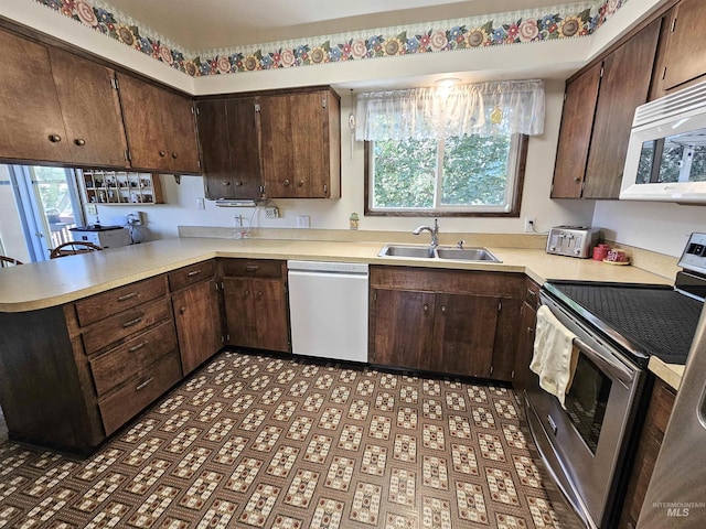 409 Garfield St, Asotin, WA 99402 - kitchen with stainless steel electric range oven, dishwasher, white microwave, and light countertops